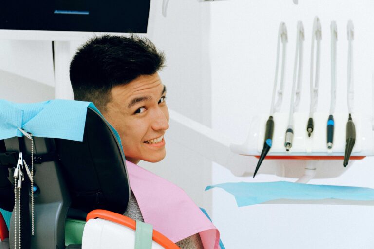 A man sitting comfortably in a chair, considering the financial aspects of emergency dentistry.