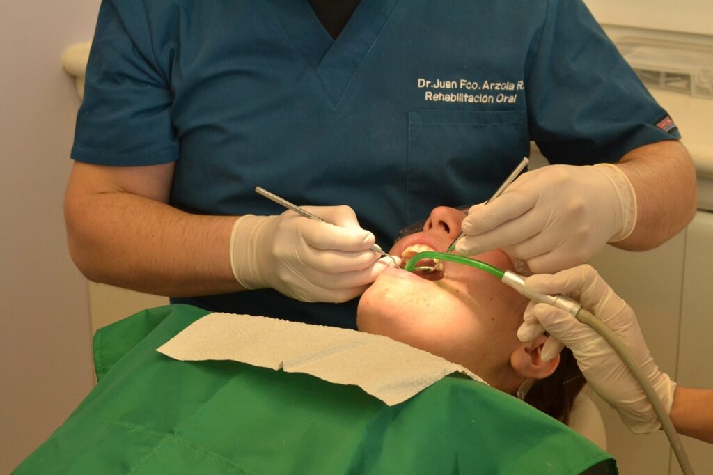 A man dressed in a green shirt, representing the significance of dental health in preventing endodontic issues.