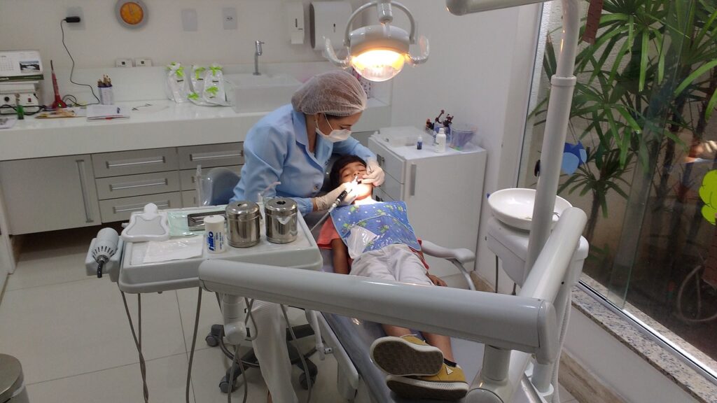 A woman comfortably positioned in a dentist chair for her regular dental check-up.